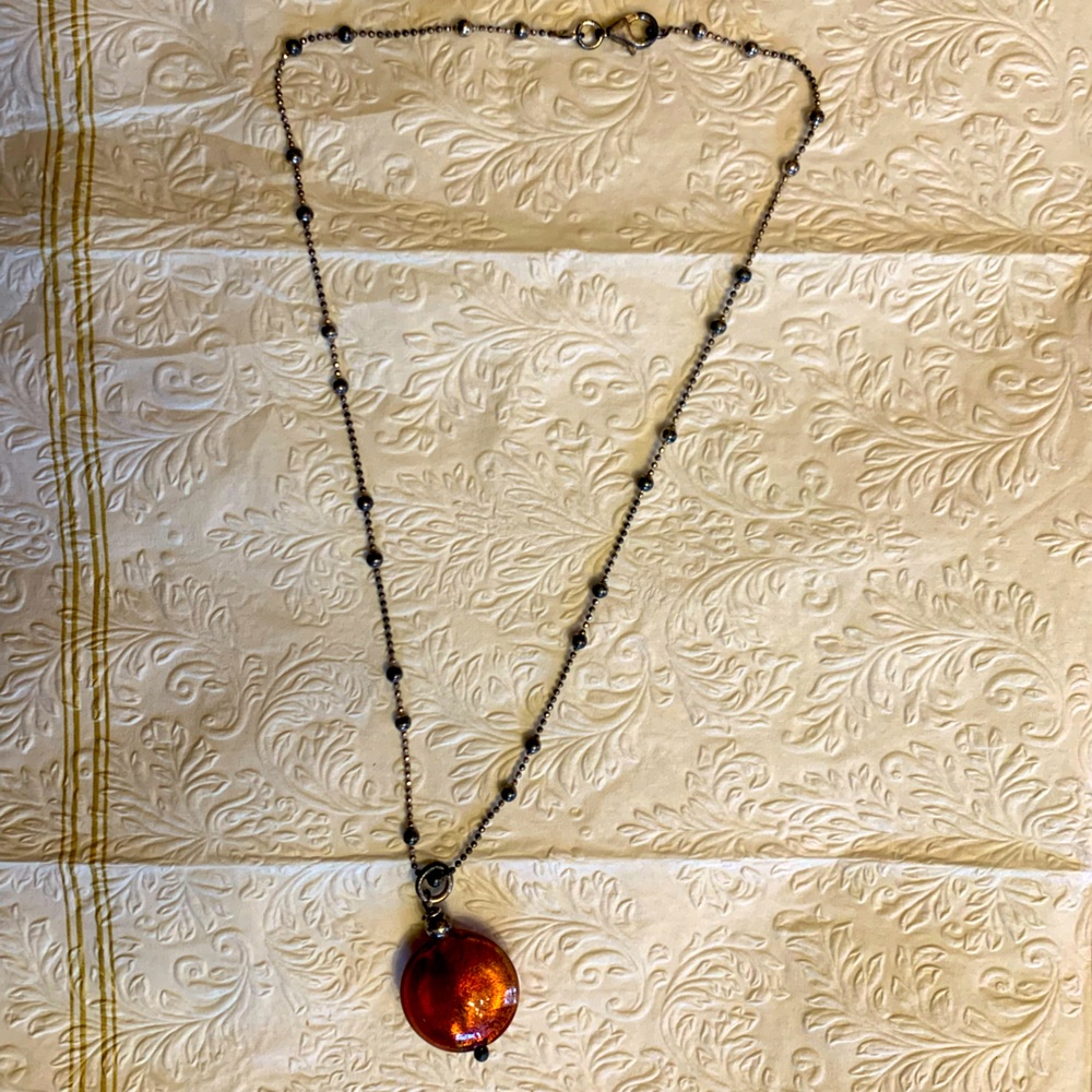 Necklace with red/orange gem